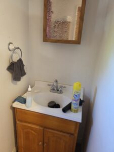 Cleaning a bathroom mirror