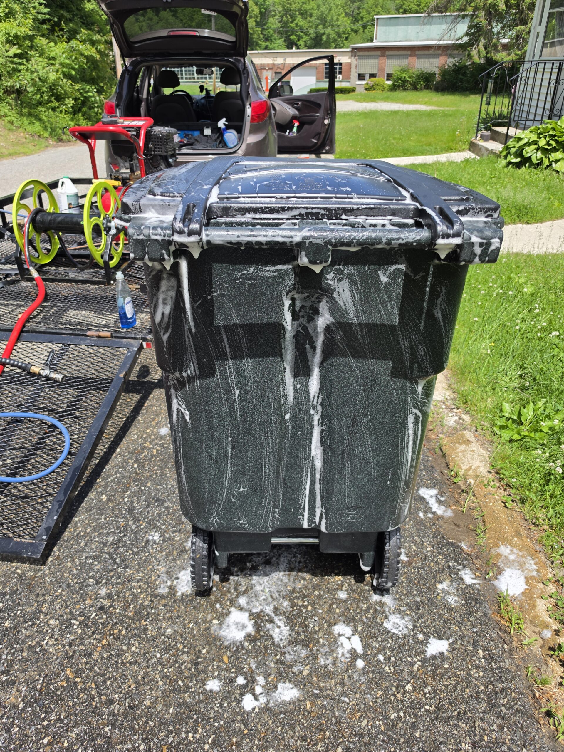 garbage and recycling bins scrubbed and washed